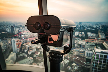 observation deck on a tall building with large binoculars to observe the beautiful panorama of Saigon or Ho Chi Minh city. Vietnam