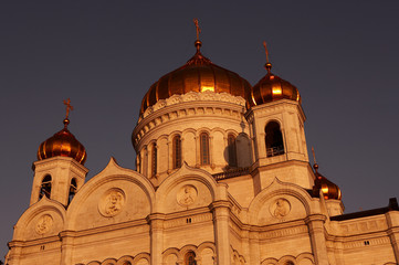 GOLD DOMES ON BELL TOWERS ON CATHEDRAL OF CHRIST THE SAVIOUR AT TWILIGHT MOSCOW RUSSIA