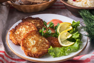 Potato pancakes c caviar and salmon. Tasty potato pancakes on a plate.
