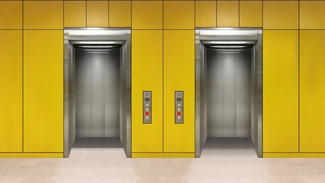Sliding steel door elevator open showing lift interior. Office building with yellow walls.