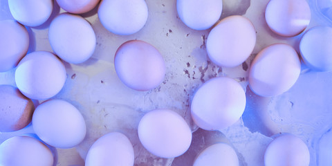 chicken eggs are colored with strainers. no focus, blur