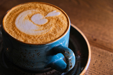 Closeup of blue cappuccino cup
