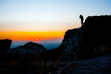 Skopje, Macedonia - november 2011. Mountain Vodno, tourists on the backdrop of the setting sun.