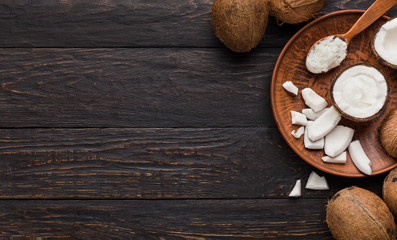 Coconut products over wooden background