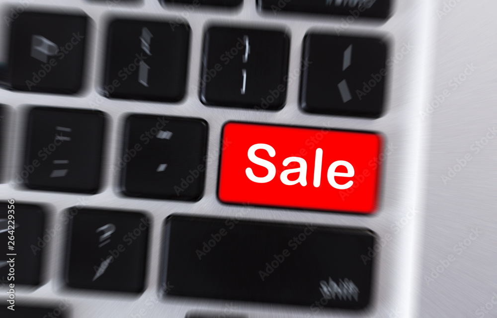 Poster saletext on red button on laptop keyboard