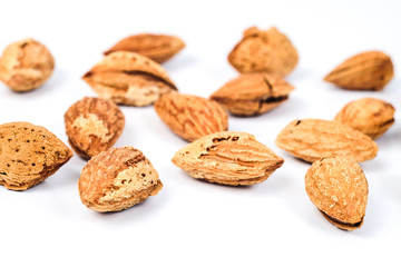 Dry Almonds nuts with shell on white background ,health food.