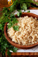Cooked quinoa in a wooden bowl