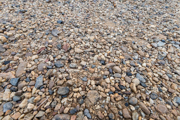 Colorful sand or pebble texture. Seamless texture on ground texture.