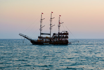 vintage boat in the sea. sunset