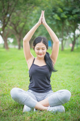 Fototapeta premium Young female warm up before exercise at the park