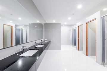 public Interior of bathroom with sink basin faucet lined up Modern design.