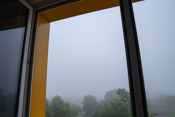 View from the open window in foggy weather