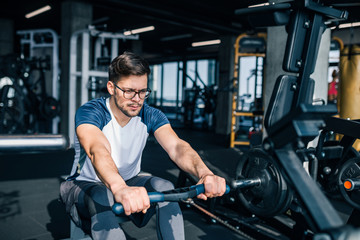 Hard workout on rowing machine.