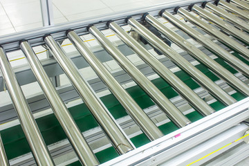 The conveyor chain, and conveyor belt on production line set up in clean room area.