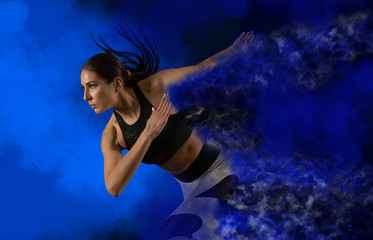 Woman sprinter leaving starting