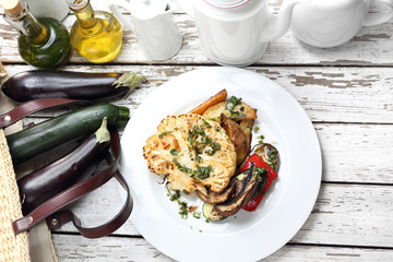 A healthy vegetable diet. Cauliflower with mushrooms baked potatoes. Vegetarian cooking