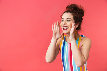 Cheerful pretty redhead woman in dress screaming and looking away