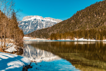 Beautiful alpine winter view with reflections at the famous Piller lake-Tyrol-Austria