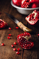 Pomegranate fruits with knife