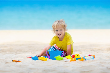 Kids playing on beach. Children play at sea.