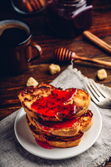 Stack of french toasts with berry marmalade