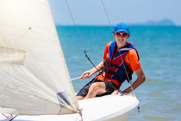 Man sailing. Boy learning to sail on sea yacht.