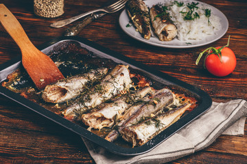 Baked fish carcasses on baking sheet
