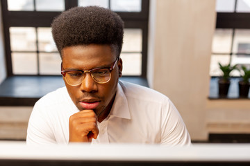 Face of a thoughtful serious young man