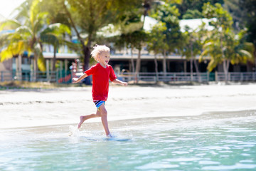 Kids playing on beach. Children play at sea.