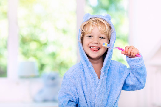 Child brushing teeth. Kids tooth brush.