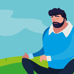 strong and bearded man seated in the field