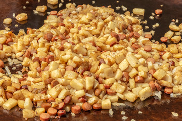 Saute onions, potatoes, and franks. Chopped festival food is always a summertime favorite.