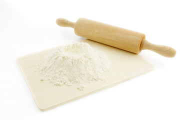 Fototapeta na wymiar rolling pin and pile of flour