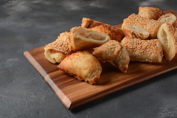 Vegetarian samosas pastries filled with potato, mushrooms, tuna. Middle Eastern food- samsa Bourekas delicious Middle Eastern hand pies. Baked, stuffed pastries filled with potato, mushrooms, tuna.