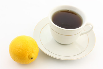 cup of tea with lemon on white background