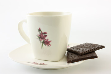 cup of tea and cookies on white background