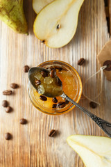 candied fruit jelly. pear marmalade with coffee beans. Jar of pear jam