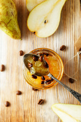 candied fruit jelly. pear marmalade with coffee beans. Jar of pear jam