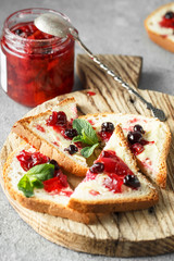 candied fruit jelly. grapefruit marmalade with berry platter. Jar of blood orange jam
