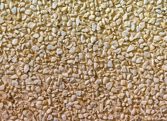 Natural white gravel background on a sunny day