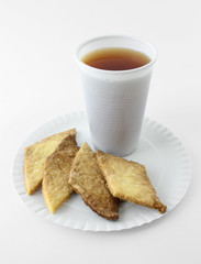 cup of coffee and cookies on table