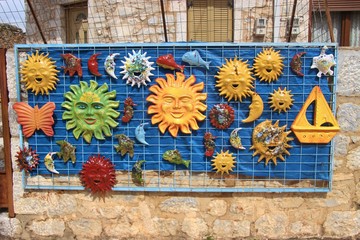 Colorful ceramic souvenirs sold outdoors, in front of a souvenir shop in the village Dirou. In the Inner Mani,  Peloponnese, Greece, South-east Europe.