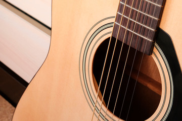 Obraz premium Acoustic guitar. Separate fragment. Musical instrument.