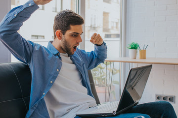 young man caught watching the laptop