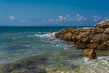 Waves breaking on a stony beach in Murter, Croatia, Dalmatia