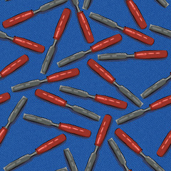 Seamless texture of building tools on a background of blue denim. carpenter's chisel tool , chisel