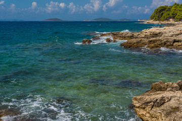 Waves breaking on a stony beach in Murter, Croatia, Dalmatia