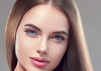 Beautiful brunette woman with long smooth hair beauty hairstyle female portrait
