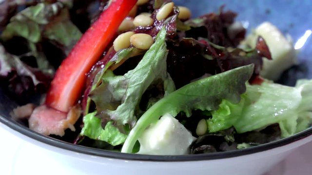Salad from vegetables and fruit strawberries close-up