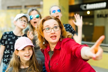 Mothers with daughters walking the downtown.